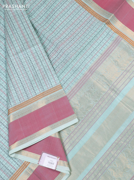Kanchipuram silk cotton saree mild teal and peach pink with allover thread checks & 1000 buttas and rettapet zari woven border