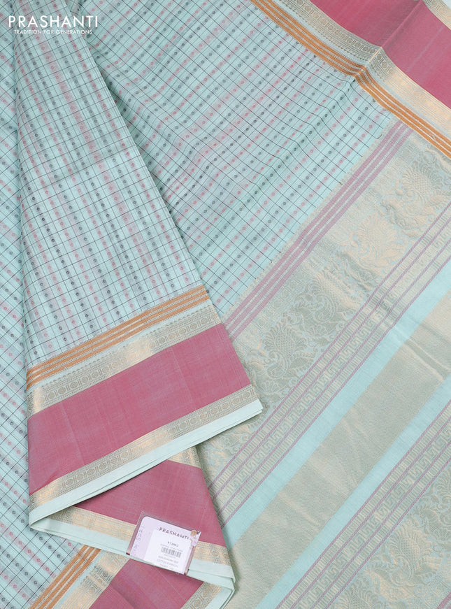Kanchipuram silk cotton saree mild teal and peach pink with allover thread checks & 1000 buttas and rettapet zari woven border