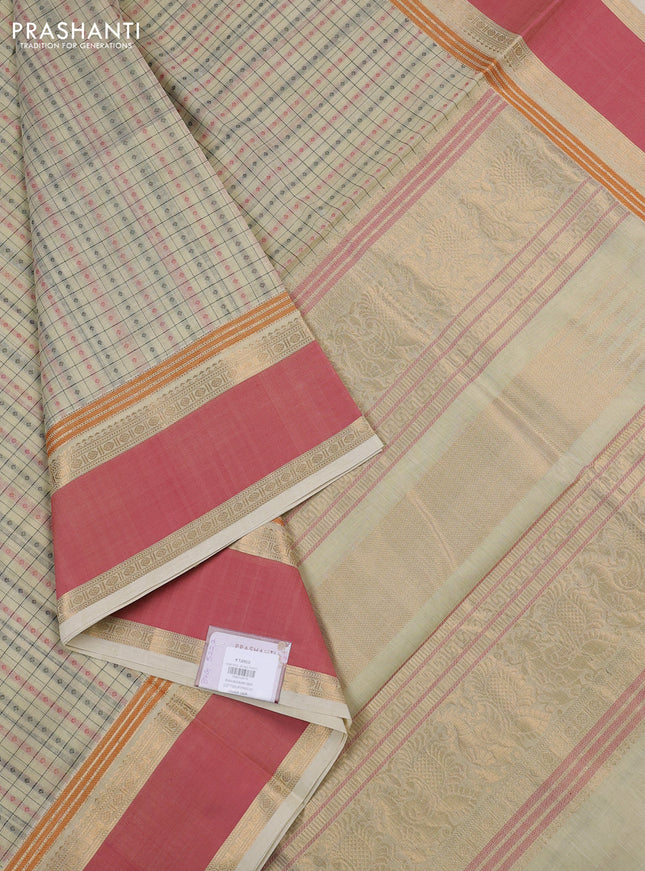 Kanchipuram silk cotton saree cream and peach pink with allover thread checks & 1000 buttas and rettapet zari woven border