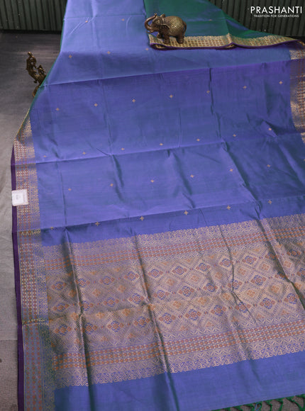 Kanchipuram silk cotton saree dual shade of bluish green and purple with zari woven buttas and zari woven border