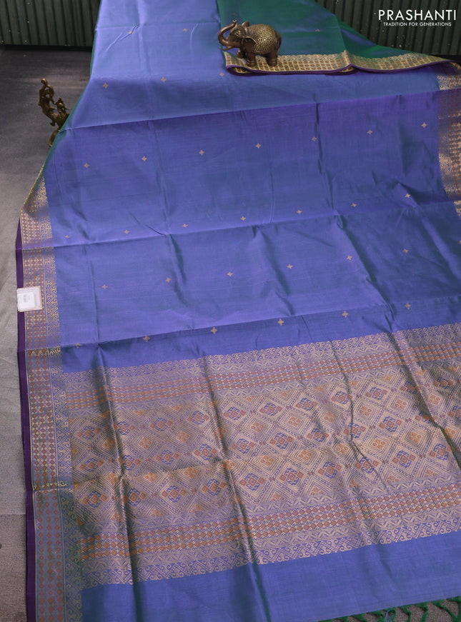 Kanchipuram silk cotton saree dual shade of bluish green and purple with zari woven buttas and zari woven border