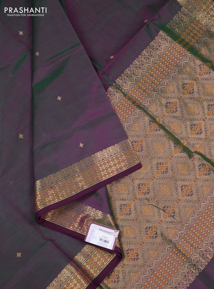Kanchipuram silk cotton saree dual shade of greenish purple and wine shade with zari woven buttas and zari woven border