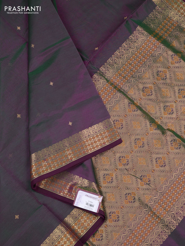 Kanchipuram silk cotton saree dual shade of greenish purple and wine shade with zari woven buttas and zari woven border