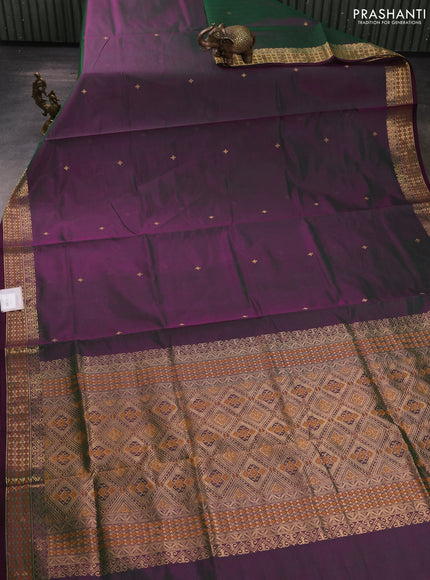 Kanchipuram silk cotton saree dual shade of greenish purple and wine shade with zari woven buttas and zari woven border