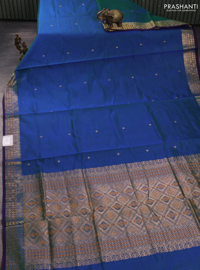 Kanchipuram silk cotton saree dual shade of bluish green and purple with zari woven buttas and zari woven border