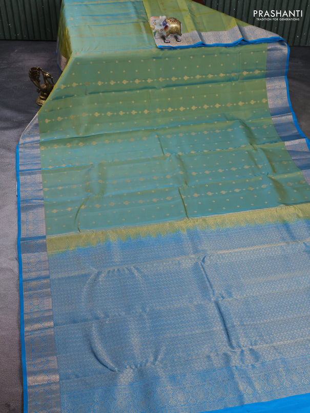 Kanchipuram silk saree dual shade of light green and cs blue with allover zari woven 1000 buttas and rich zari woven border