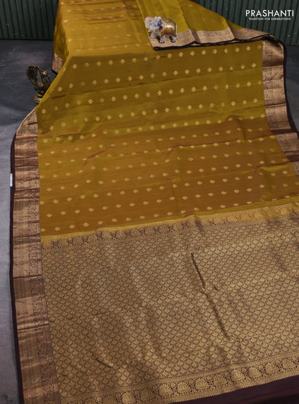 Kanchipuram silk saree dark mustard and coffee brown with allover zari woven buttas and rich zari woven border