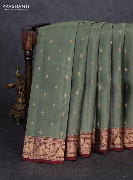 Kanchipuram silk saree pastel green shade and deep maroon with allover zari woven 1000 buttas and annam & temple zari woven border