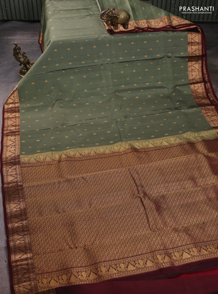 Kanchipuram silk saree pastel green shade and deep maroon with allover zari woven 1000 buttas and annam & temple zari woven border