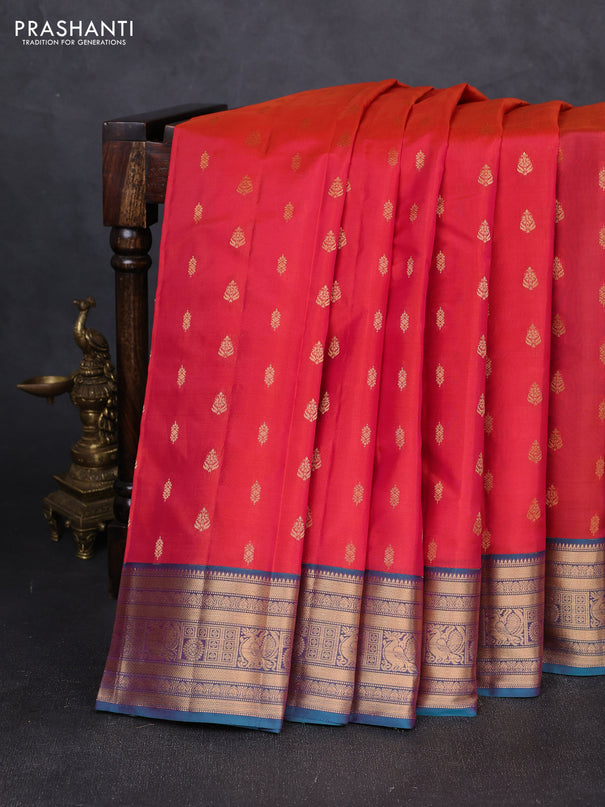 Kanchipuram silk saree dual shade of pinkish orange and dual shade of teal green with allover zari woven 1000 buttas and zari woven border
