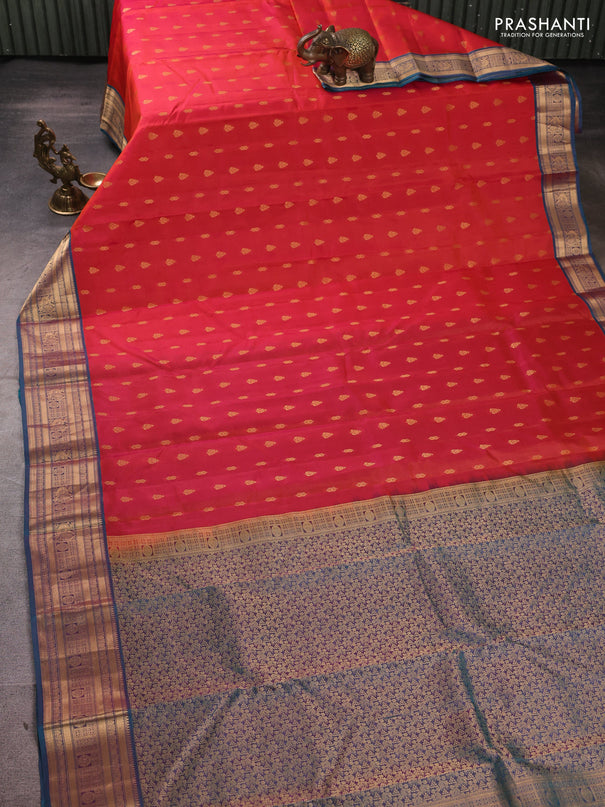 Kanchipuram silk saree dual shade of pinkish orange and dual shade of teal green with allover zari woven 1000 buttas and zari woven border