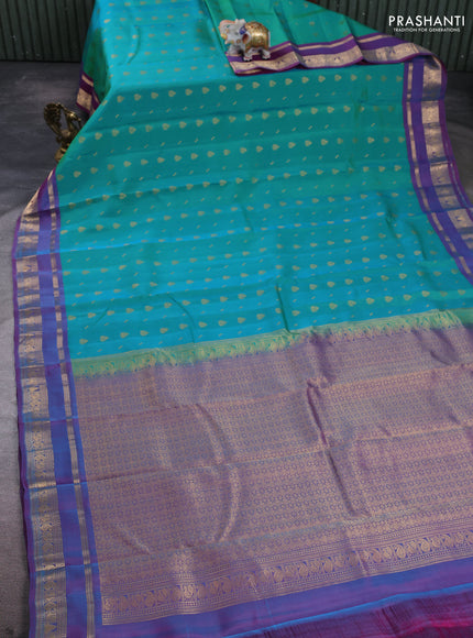 Kanchipuram silk saree dual shade of teal green and purple with allover zari woven 1000 buttas and rettapet zari woven border