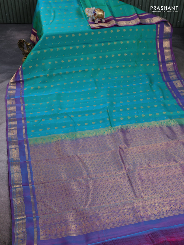 Kanchipuram silk saree dual shade of teal green and purple with allover zari woven 1000 buttas and rettapet zari woven border