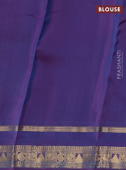Kanchipuram silk saree dual shade of teal green and purple with allover zari woven 1000 buttas and rettapet zari woven border