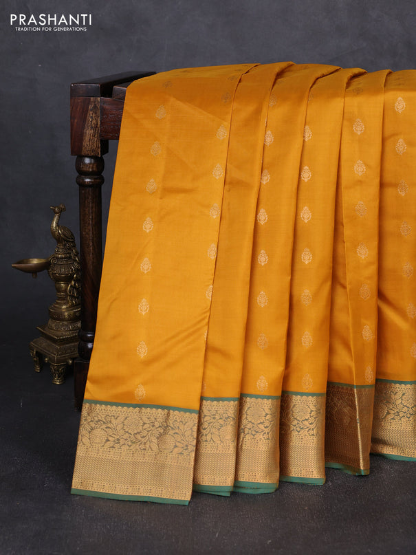 Kanchipuram silk saree mustard yellow and dual shade of teal green with allover zari woven buttas and rich zari woven border