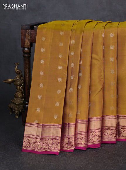 Kanchipuram silk saree dark mustard and dark magenta pink with allover zari woven buttas and rich zari woven border