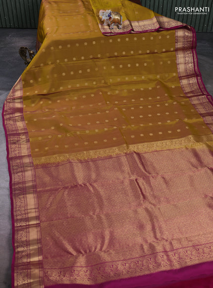 Kanchipuram silk saree dark mustard and dark magenta pink with allover zari woven buttas and rich zari woven border