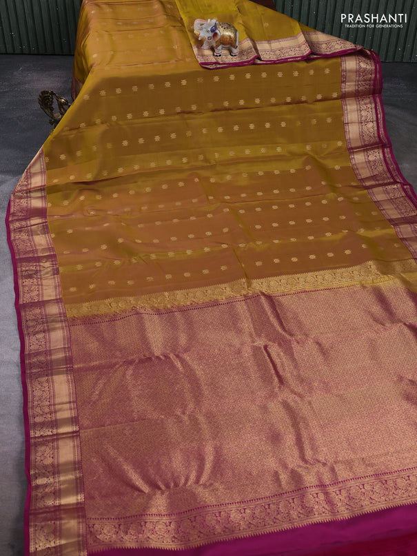 Kanchipuram silk saree dark mustard and dark magenta pink with allover zari woven buttas and rich zari woven border