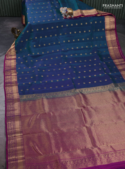 Kanchipuram silk saree dual shade of peacock green and purple with allover zari woven buttas and rich zari woven border