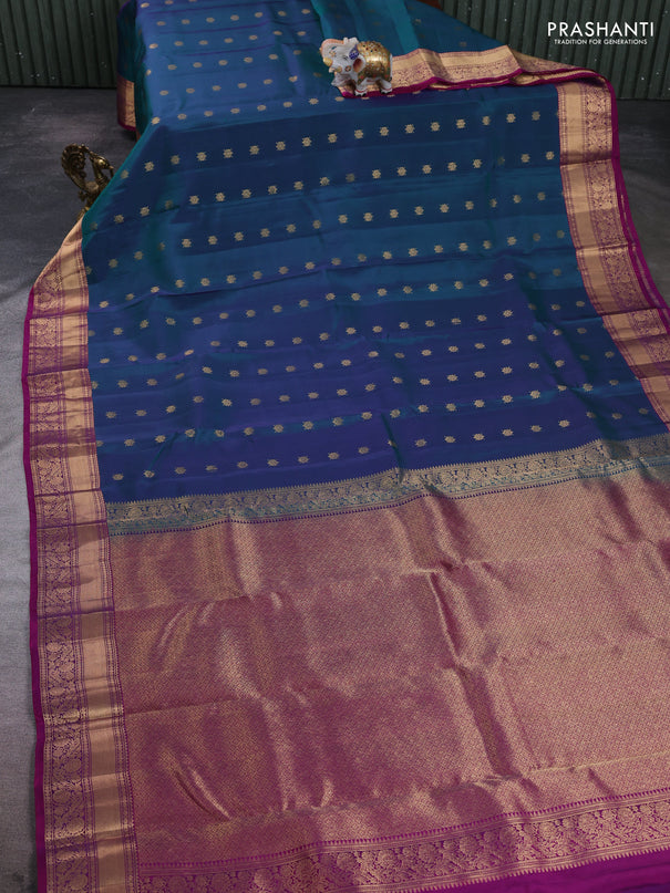 Kanchipuram silk saree dual shade of peacock green and purple with allover zari woven buttas and rich zari woven border