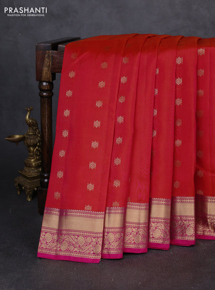 Kanchipuram silk saree dual shade of pinkish orange and pink with allover zari woven buttas and rich zari woven border