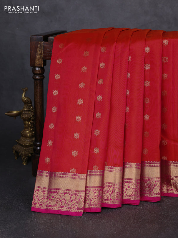 Kanchipuram silk saree dual shade of pinkish orange and pink with allover zari woven buttas and rich zari woven border