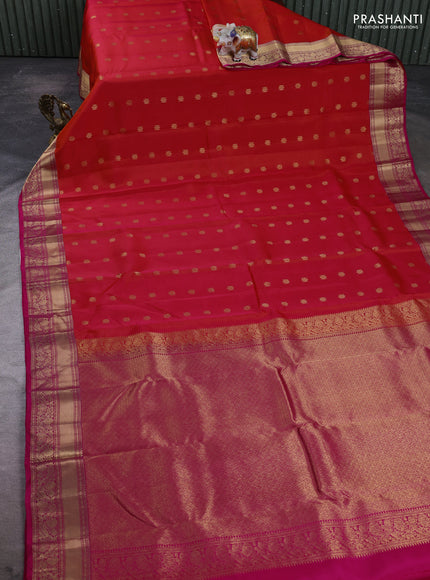 Kanchipuram silk saree dual shade of pinkish orange and pink with allover zari woven buttas and rich zari woven border