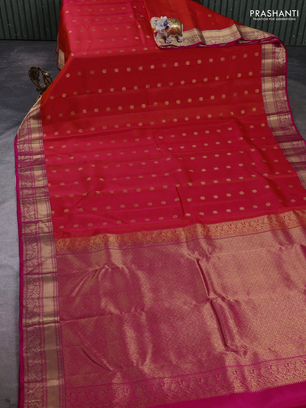 Kanchipuram silk saree dual shade of pinkish orange and pink with allover zari woven buttas and rich zari woven border