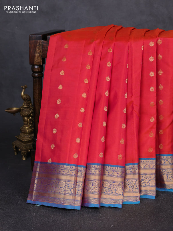 Kanchipuram silk saree dual shade of pinkish orange and dual shade of blue with allover zari woven 1000 buttas and rich zari woven border