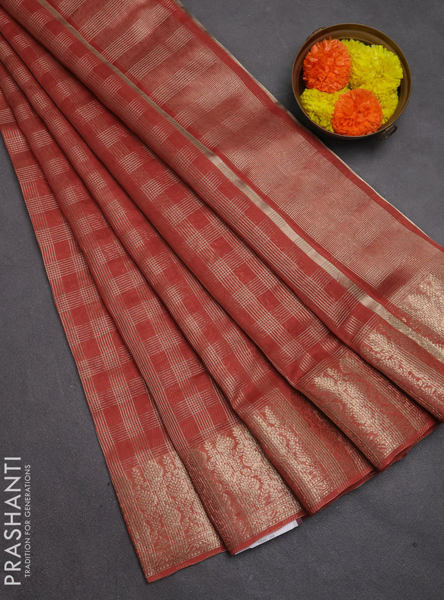 Banarasi silk cotton saree rust shade with allover small zari checked pattern and zari woven border