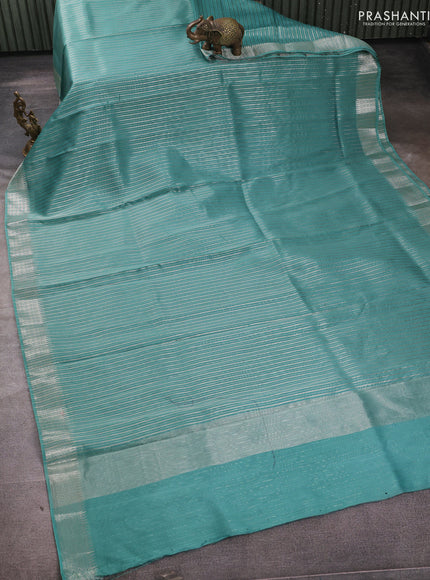 Banarasi silk cotton saree teal green with allover zari stripe pattern and zari wovenn border