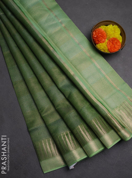 Banarasi silk cotton saree light green and pista green with allover zari stripe pattern and zari woven border