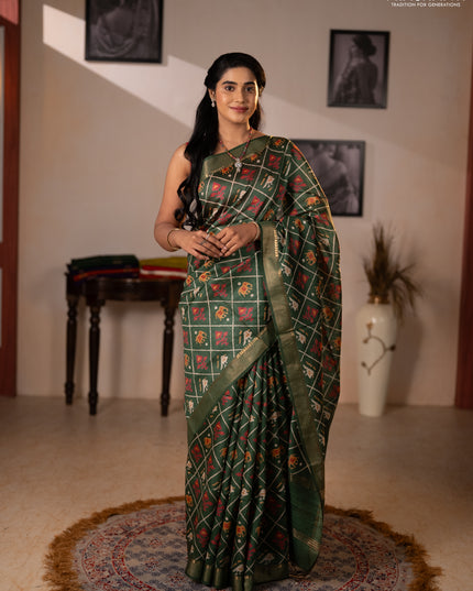 Munga tussar silk saree green with allover patola prints and zari woven border