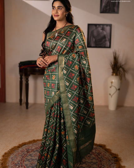 Munga tussar silk saree green with allover patola prints and zari woven border