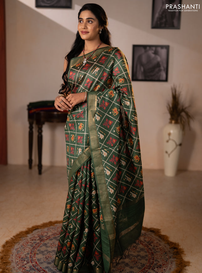 Munga tussar silk saree green with allover patola prints and zari woven border
