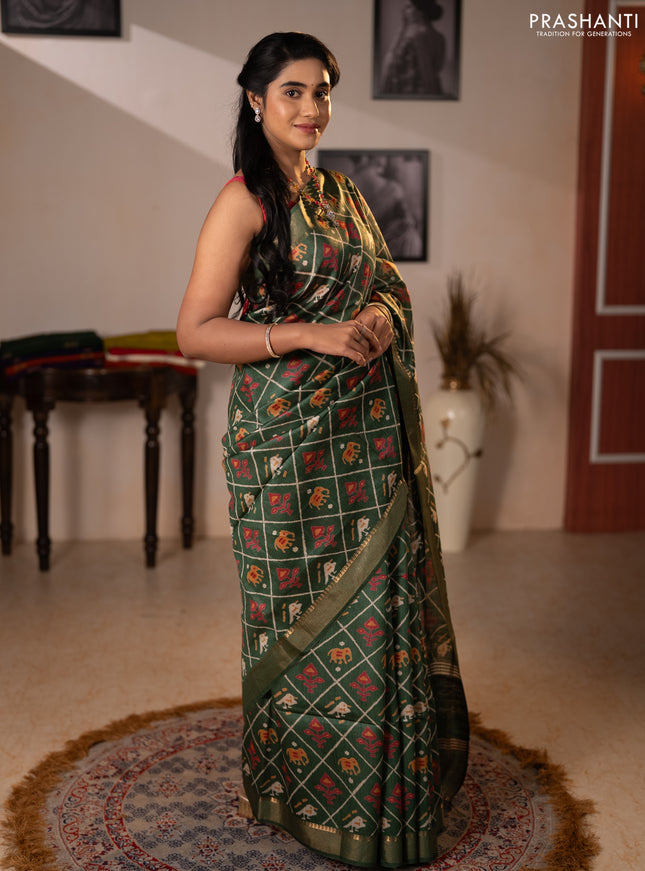 Munga tussar silk saree green with allover patola prints and zari woven border