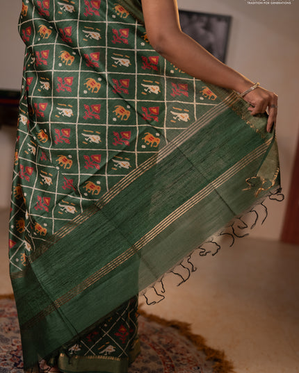 Munga tussar silk saree green with allover patola prints and zari woven border