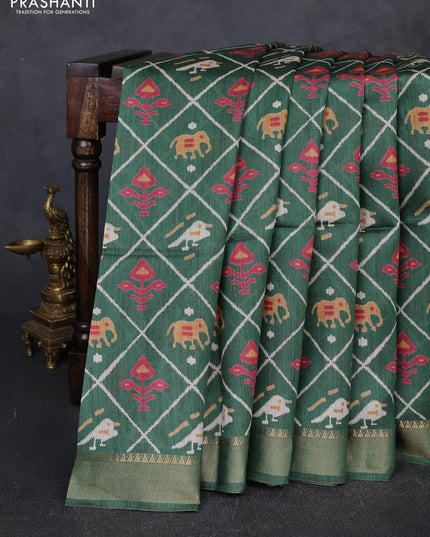 Munga tussar silk saree green with allover patola prints and zari woven border