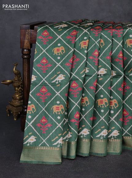 Munga tussar silk saree green with allover patola prints and zari woven border