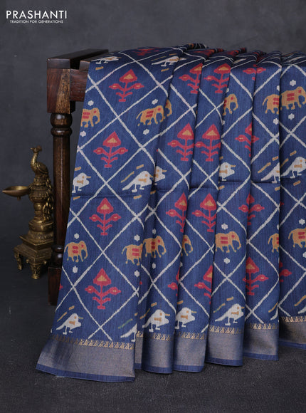 Munga tussar silk saree peacock blue with allover patola prints and zari woven border