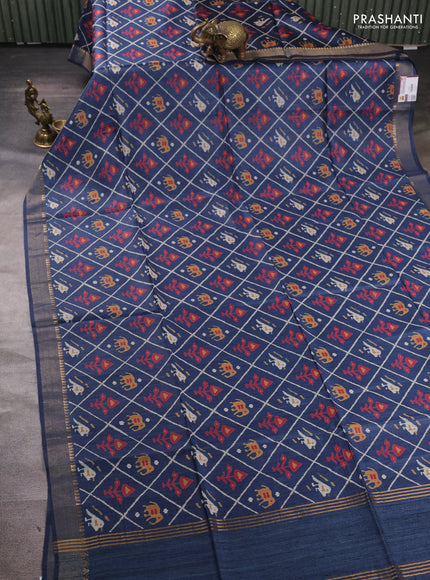 Munga tussar silk saree peacock blue with allover patola prints and zari woven border