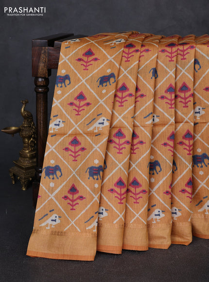 Munga tussar silk saree mustard yellow with allover patola prints and zari woven border