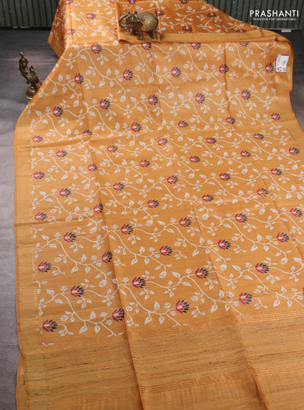 Munga tussar silk saree mustard yellow with allover prints and zari woven border