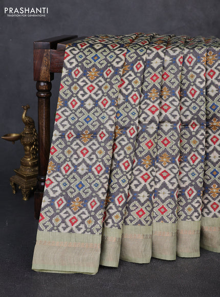 Munga tussar silk saree pastel green and grey with allover ajrakh prints and zari woven border