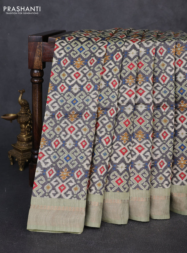 Munga tussar silk saree pastel green and grey with allover ajrakh prints and zari woven border