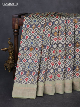 Munga tussar silk saree pastel green and grey with allover ajrakh prints and zari woven border