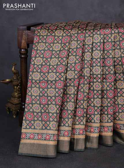 Munga tussar silk saree deep sap green with allover ajrakh prints and zari woven border