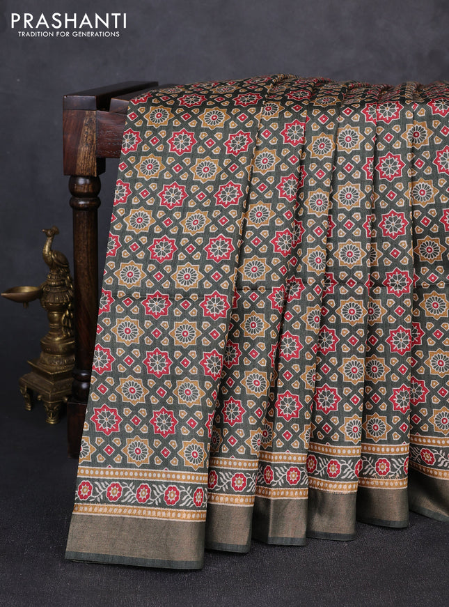 Munga tussar silk saree deep sap green with allover ajrakh prints and zari woven border