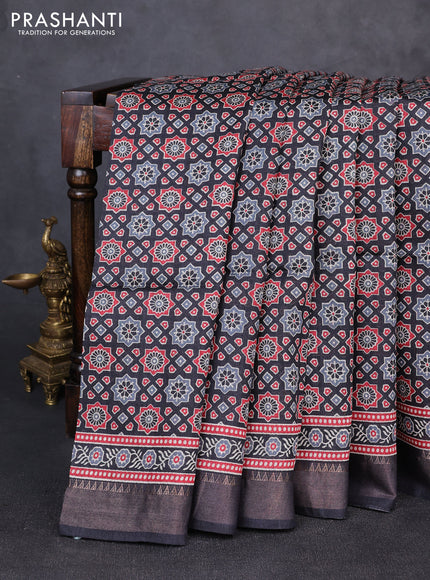 Munga tussar silk saree black with allover ajrakh prints and zari woven border