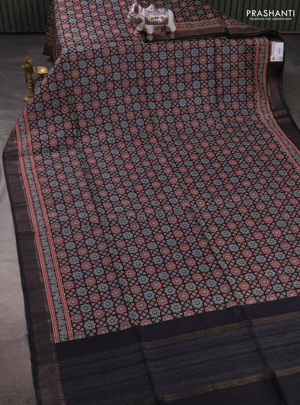 Munga tussar silk saree black with allover ajrakh prints and zari woven border